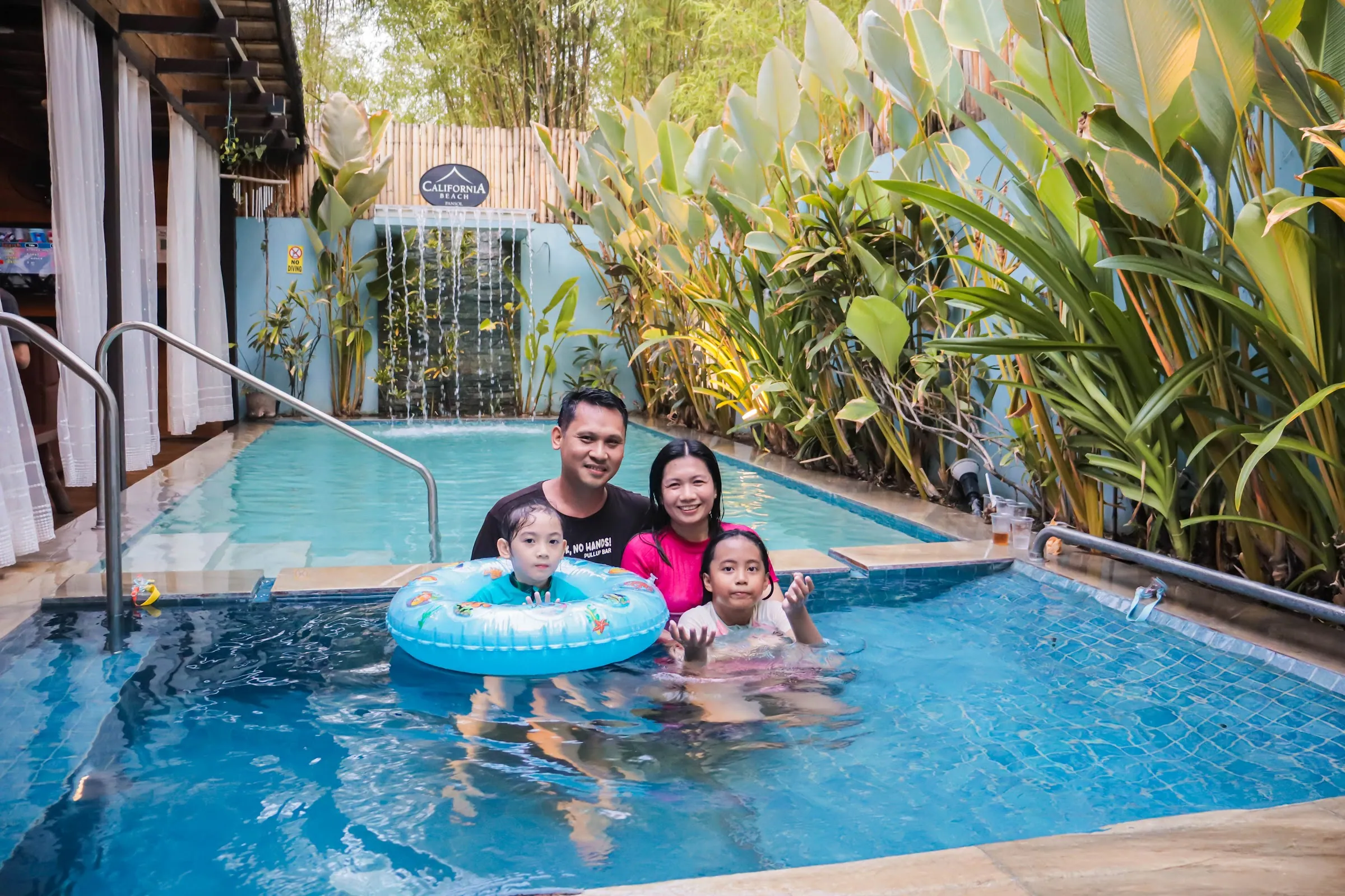 A family enjoying the private pool together