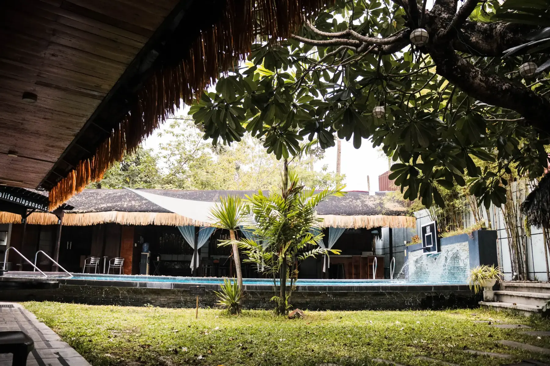 Villa 3 — garden courtyard with kalachuchi trees and cabanas